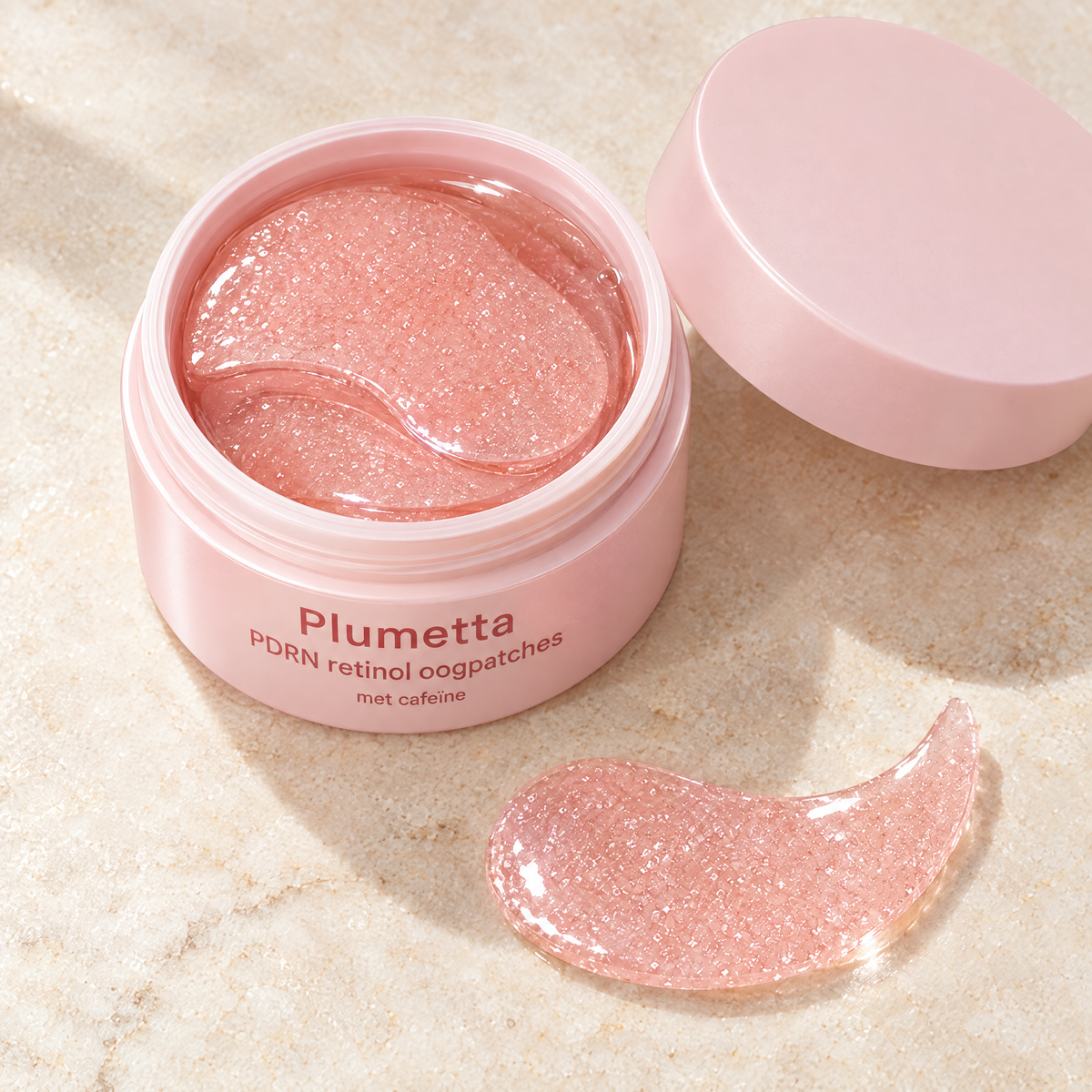 Open pot Plumetta PDRN oogpatches van bovenaf met roze hydrogel patches en één losse patch ernaast